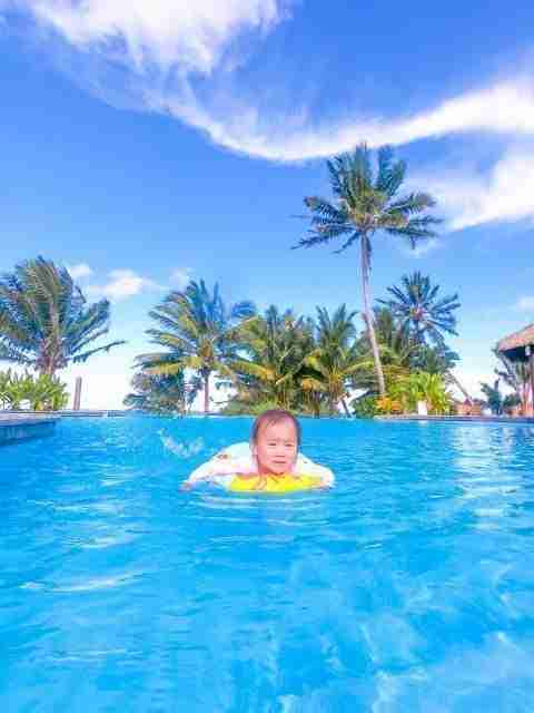 Nautilus Resort toddler swimming in the infinity pool
