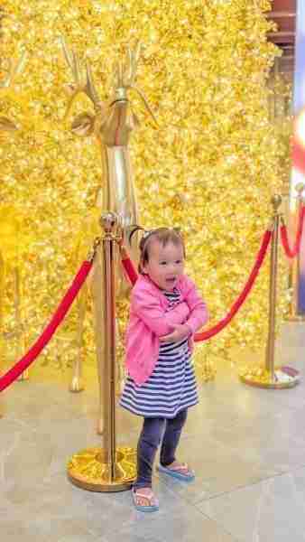 Auckland Skycity Golden Christmas Tree with Toddler