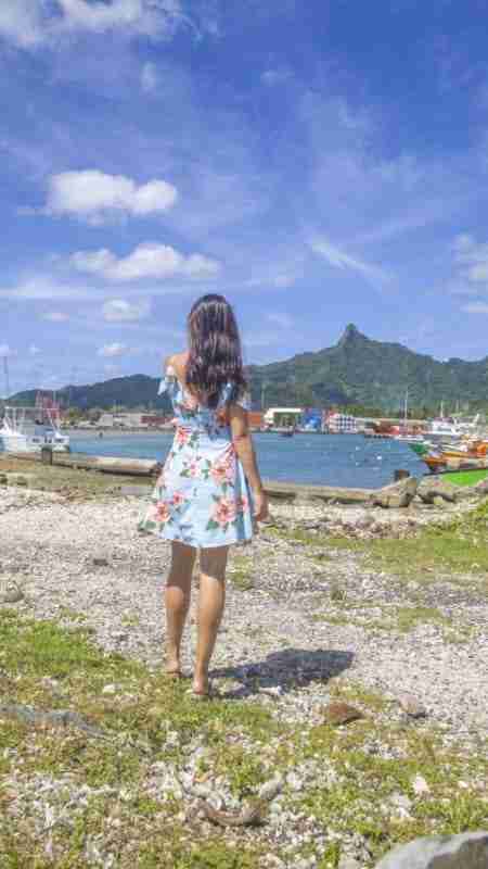 Girl overlooking Avatiu Harbour